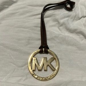 Michael Kors hang tag. Gold with chocolate brown strap